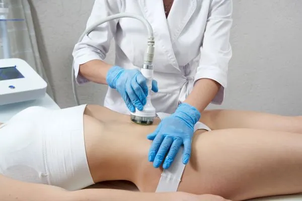 Lost the Weight but Not the Loose Skin? 2 woman having HIFU treatment on her stomach to combat loose skin Leicestershire following weight loss